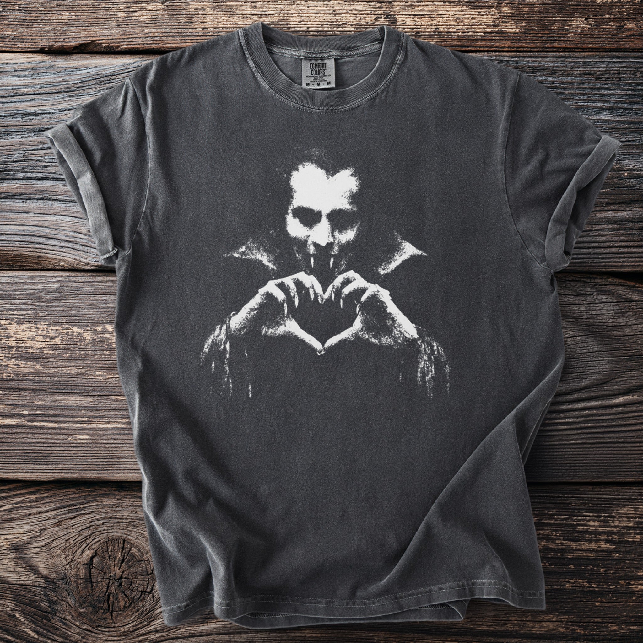 Dark grey t-shirt with a distressed white vampire graphic forming a heart with hands.