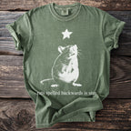 Green t-shirt with white rat and star graphic and text "rats spelled backwards is star".