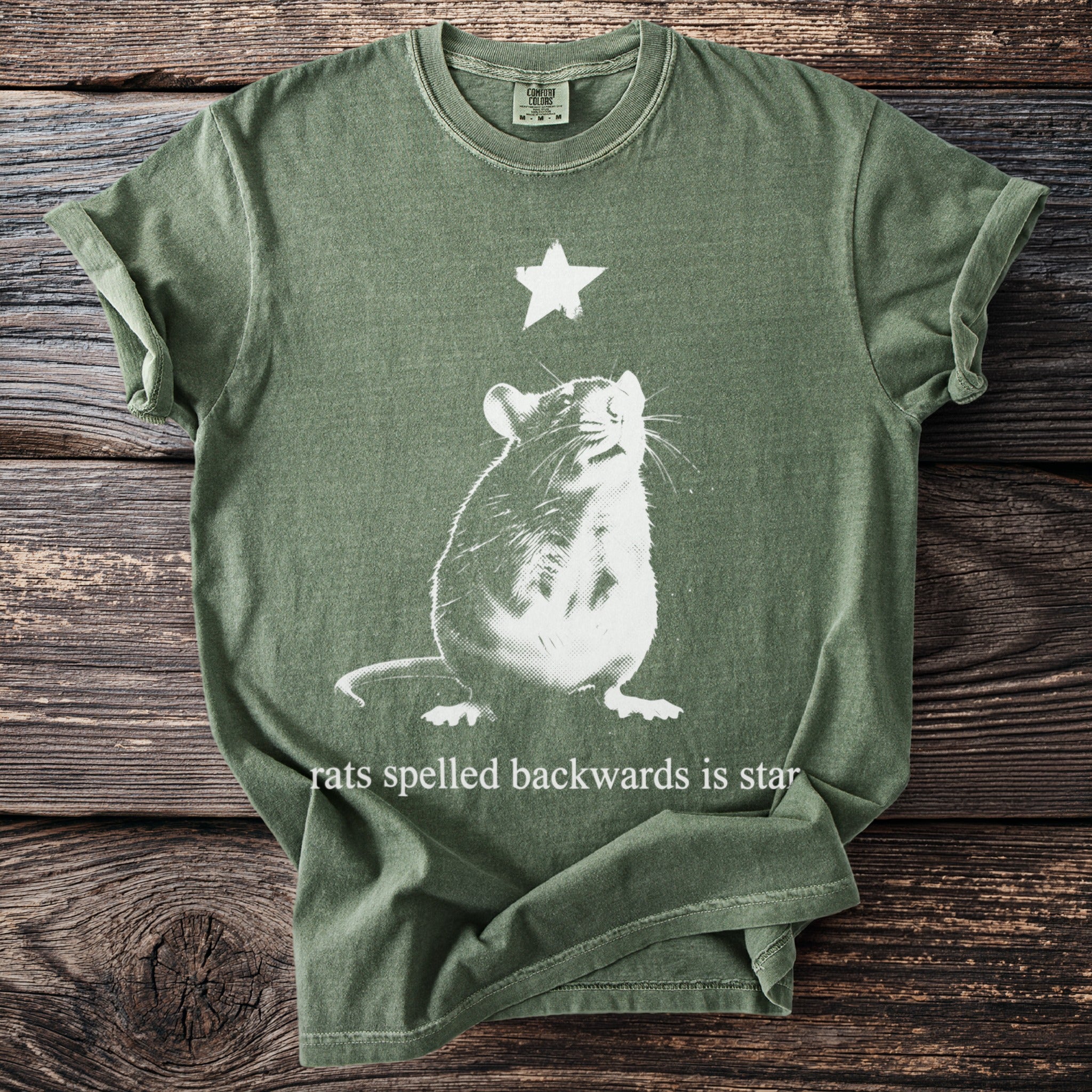 Green t-shirt with white rat and star graphic and text "rats spelled backwards is star".