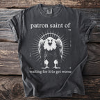 Dark grey t-shirt with graphic art of a vulture and text "patron saint of waiting for it to get worse".