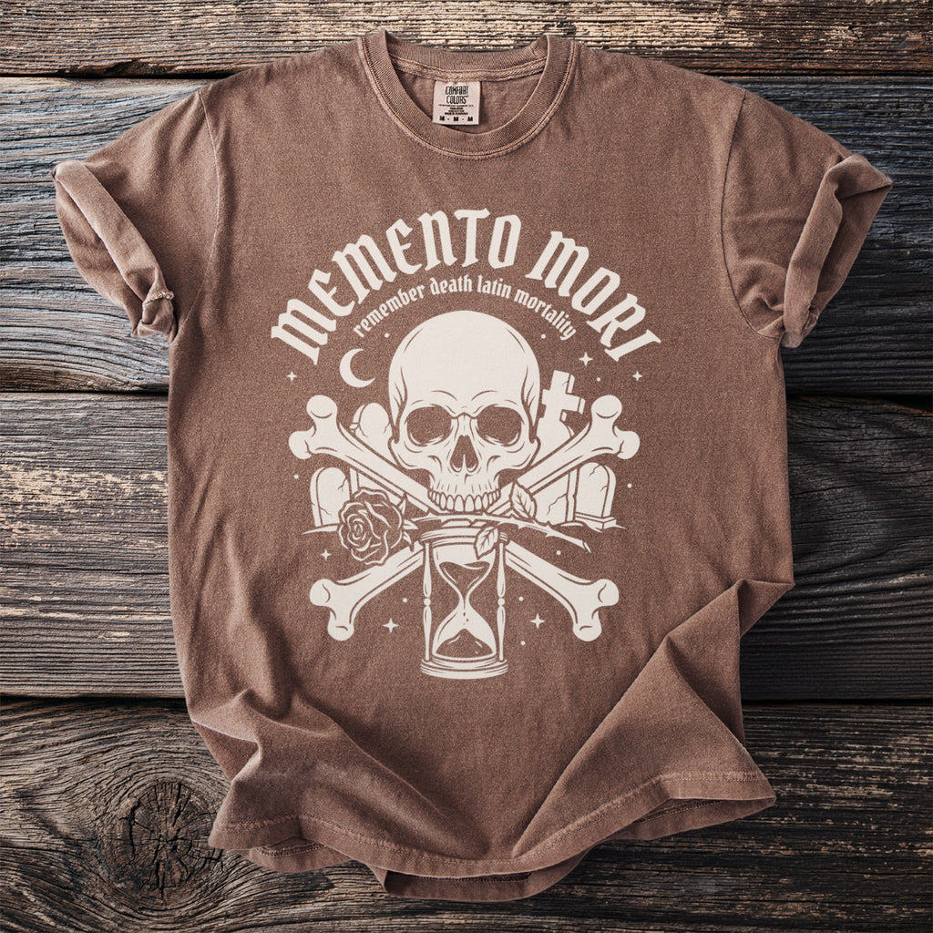 Brown t-shirt with "Memento Mori" graphic featuring a skull, hourglass, bones, and roses.
