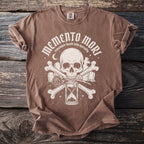 Brown t-shirt with "Memento Mori" graphic featuring a skull, hourglass, bones, and roses.