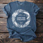 Blue t-shirt with "Love the Unloved" and illustrations of unloved creatures.