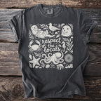 Dark t-shirt with white marine life illustration and text "respect the locals".