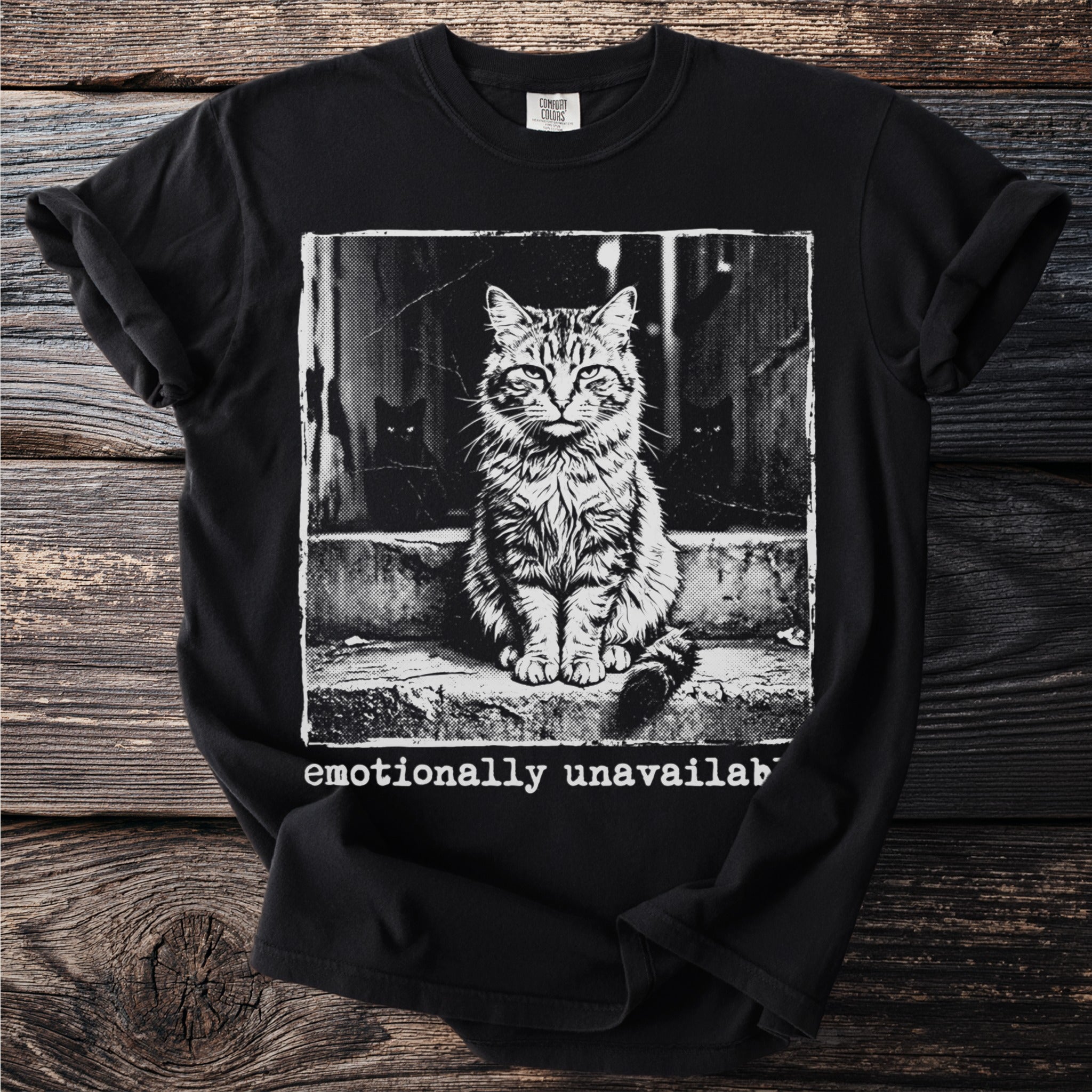Black t-shirt with a distressed grunge graphic of a cat and the text "emotionally unavailab"