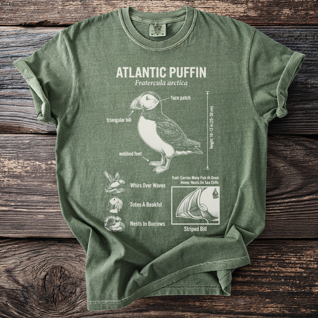 Green t-shirt with Atlantic Puffin diagram: triangular bill, face patch, webbed feet.