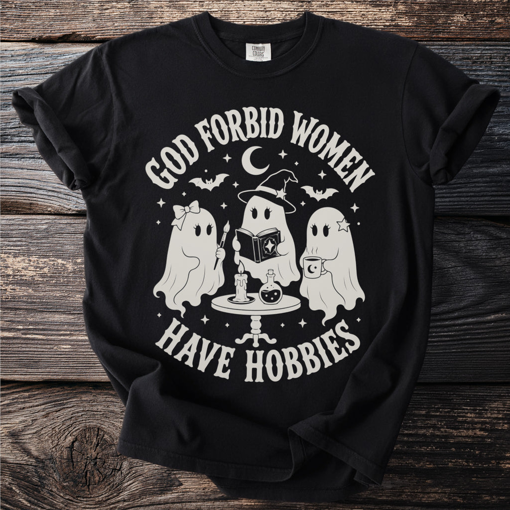 Three ghosts reading, painting, and drinking coffee with text "God Forbid Women Have Hobbies."