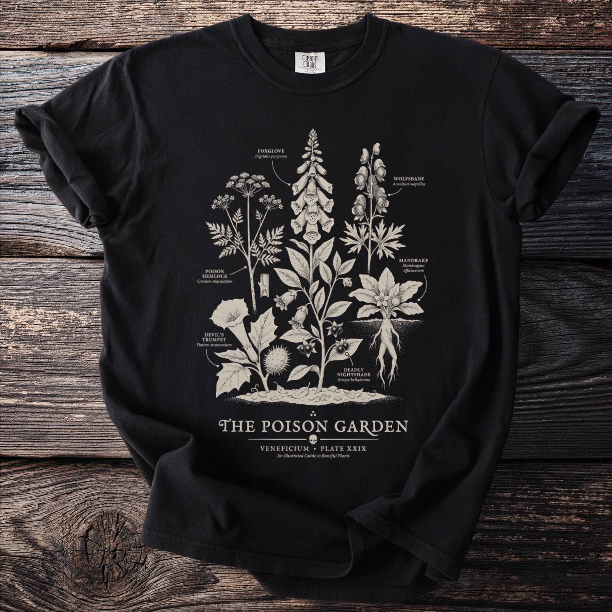 Black t-shirt with botanical illustration of "The Poison Garden" featuring toxic plants.