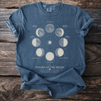 T-shirt with phases of the moon and stars graphic.