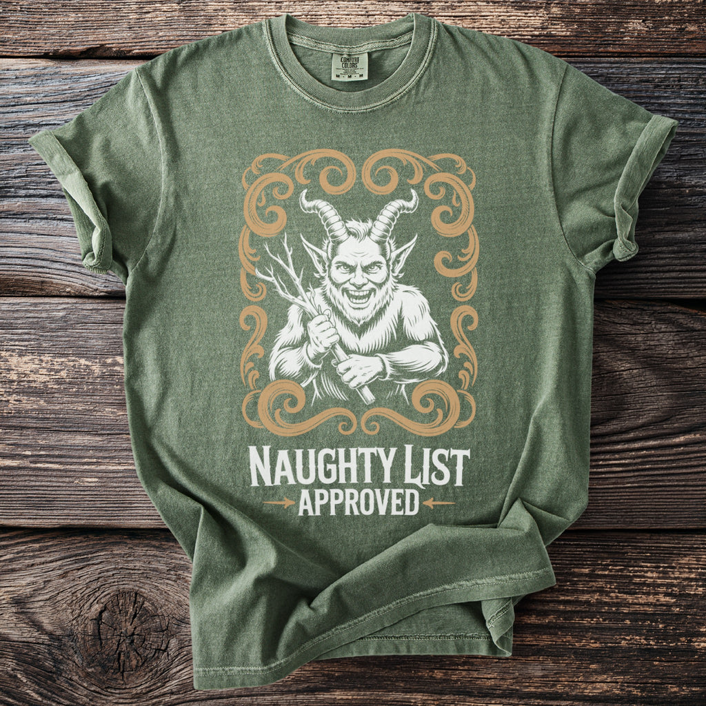 Green t-shirt with a distressed demon graphic and text reading "NAUGHTY LIST APPROVED."