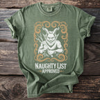 Green t-shirt with a distressed demon graphic and text reading "NAUGHTY LIST APPROVED."