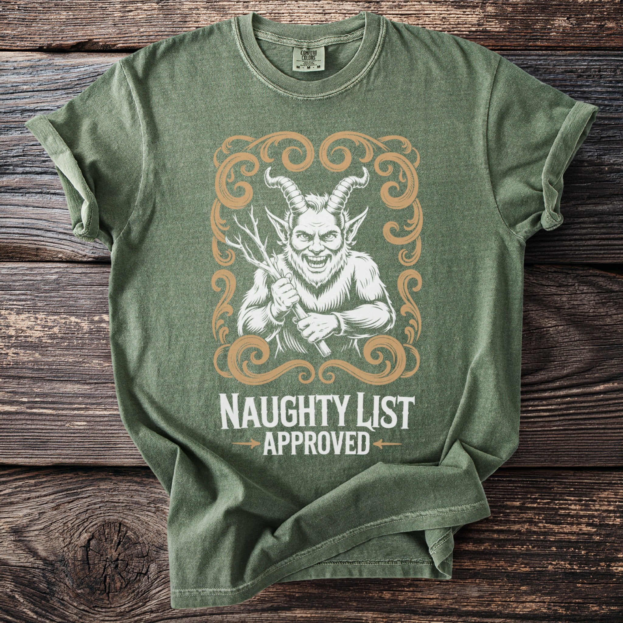 Green t-shirt with a distressed demon graphic and text reading "NAUGHTY LIST APPROVED."
