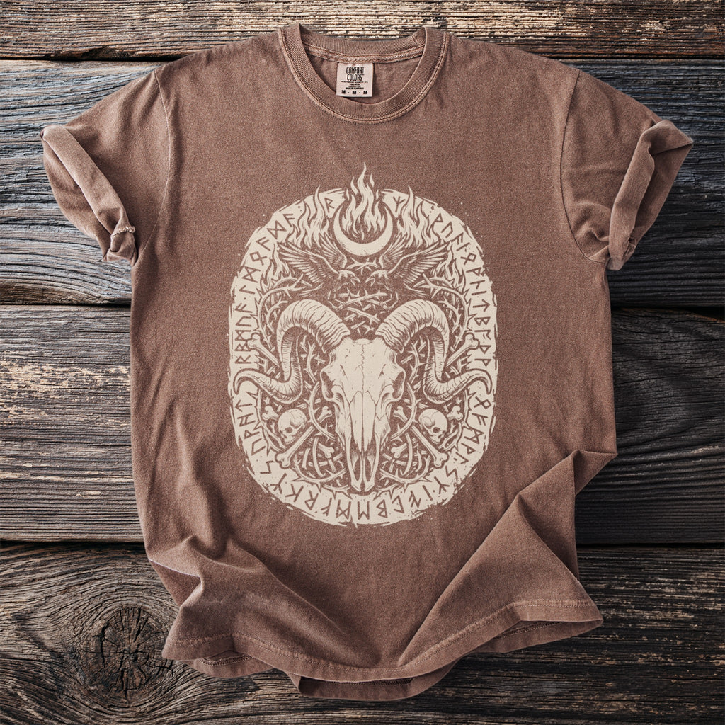 Brown t-shirt with a cream-colored graphic of a ram skull, crescent moon, and runes.