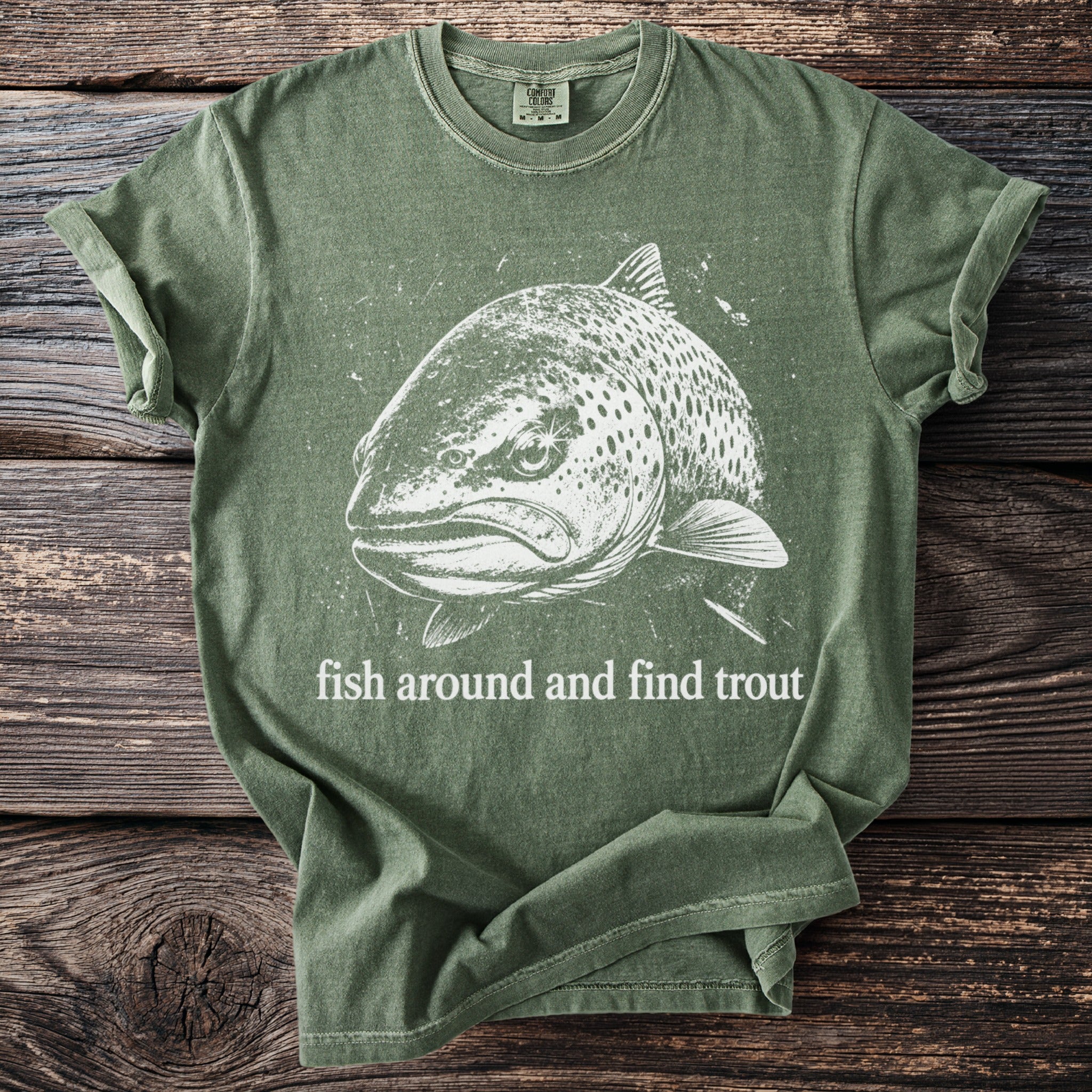 Green t-shirt with white fish graphic and "fish around and find trout" text.