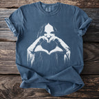 Blue t-shirt with white graphic of a face and hands forming a heart