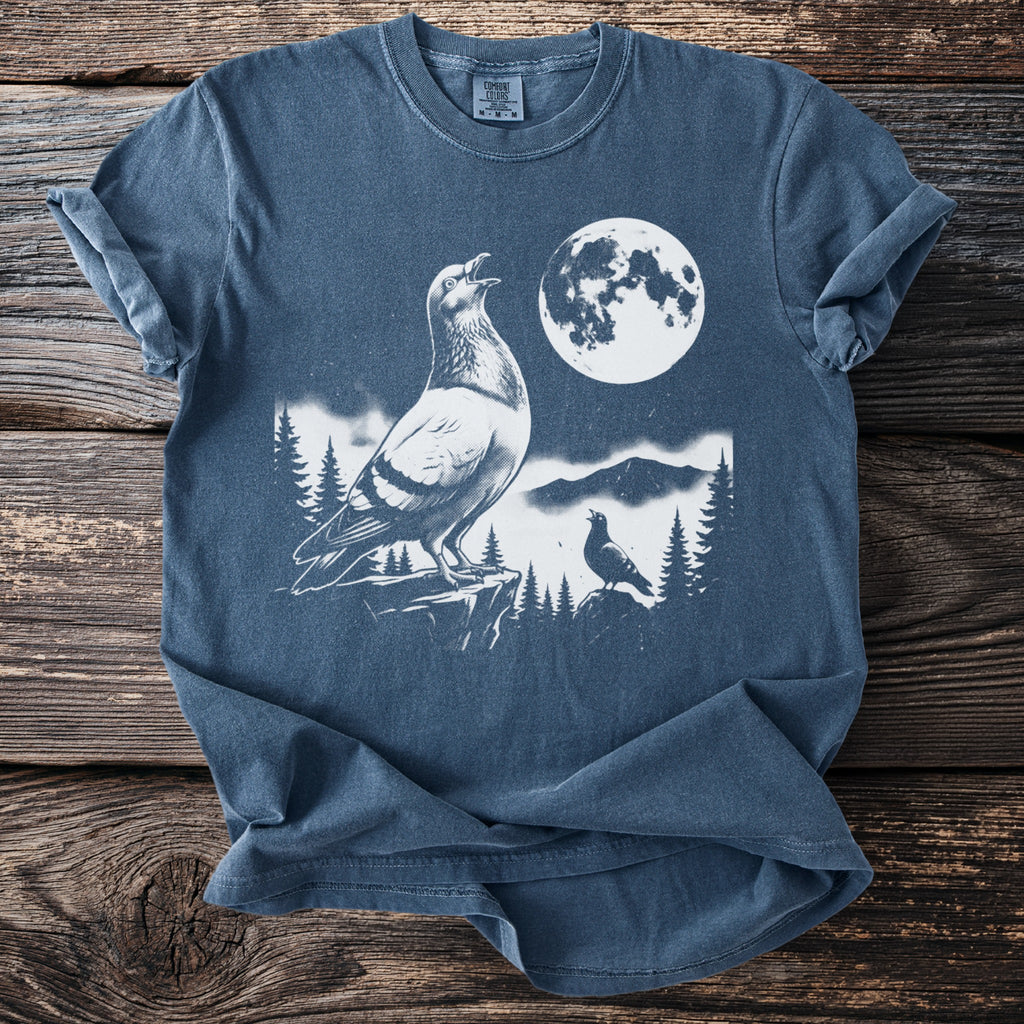 Line drawing of two pigeons and moon on a blue t-shirt.