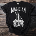 Black t-shirt with "Magician" text and a graphic of a magician at a table.