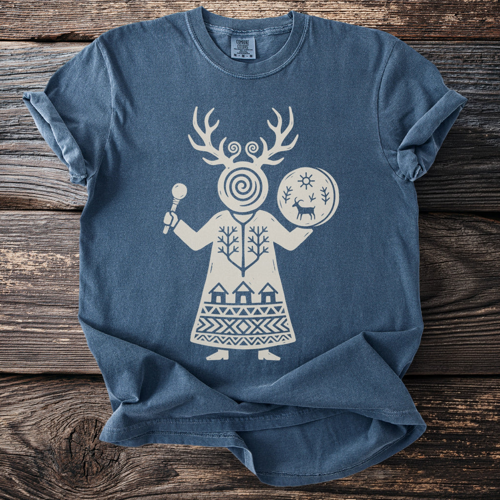 Blue t-shirt with a white graphic of a figure with antlers holding a drum.