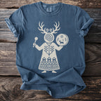 Blue t-shirt with a white graphic of a figure with antlers holding a drum.