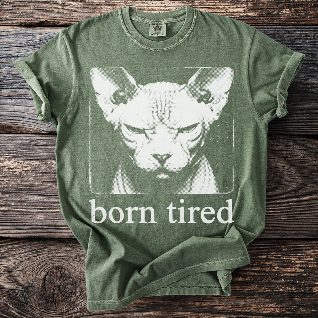 Green t-shirt with a Sphinx cat graphic and text "born tired."
