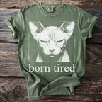Green t-shirt with a Sphinx cat graphic and text "born tired."