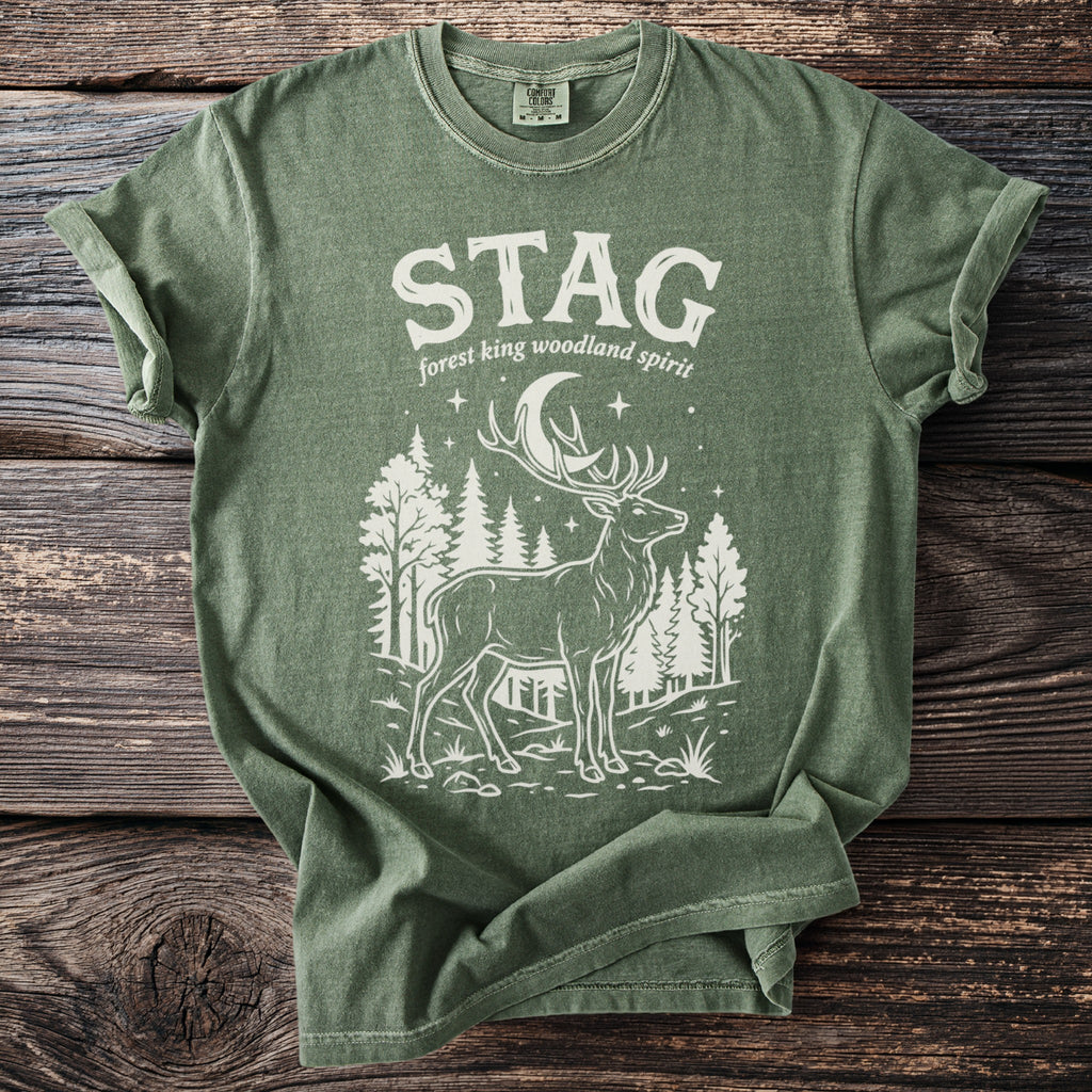 Green t-shirt with white graphic of a stag, moon, and trees.