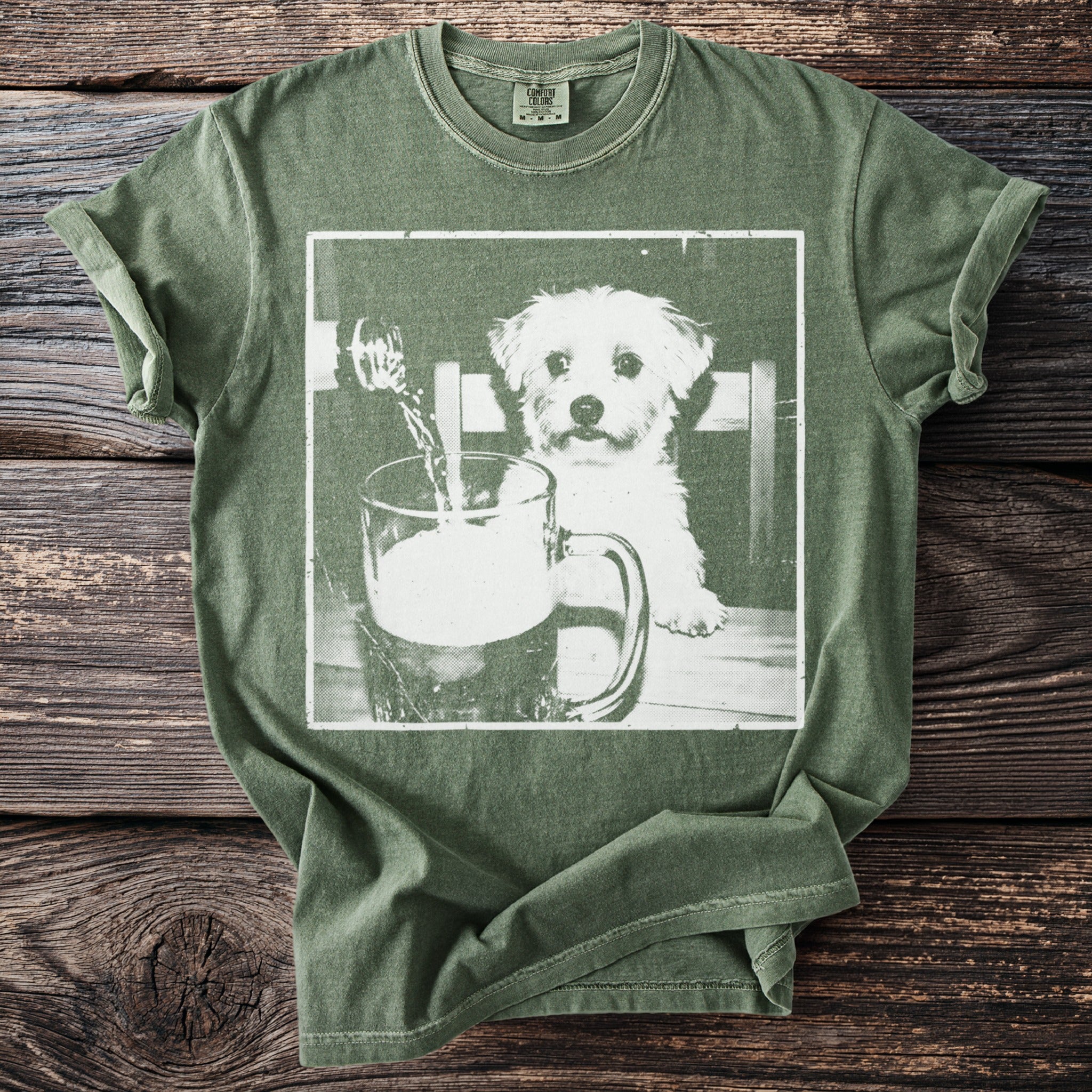 Green t-shirt with white graphic of a playful dog and a beer mug.