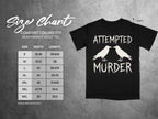 Size chart for a Comfort Colors 1717 heavyweight adult tee with "Attempted Murder" graphic.