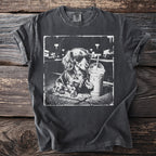 Dachshund wearing sunglasses with iced coffee on a dark t-shirt.