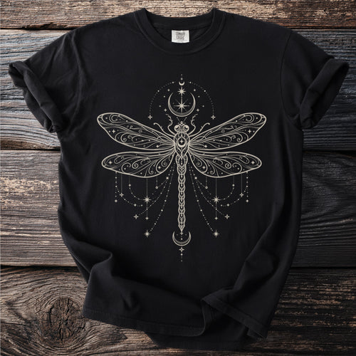 Black Comfort Colors t-shirt with cream celestial dragonfly design and moons.