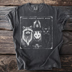 Dark t-shirt with graphic of raccoon, opossum, bat, cat, and frog and text "local cryptid support group".