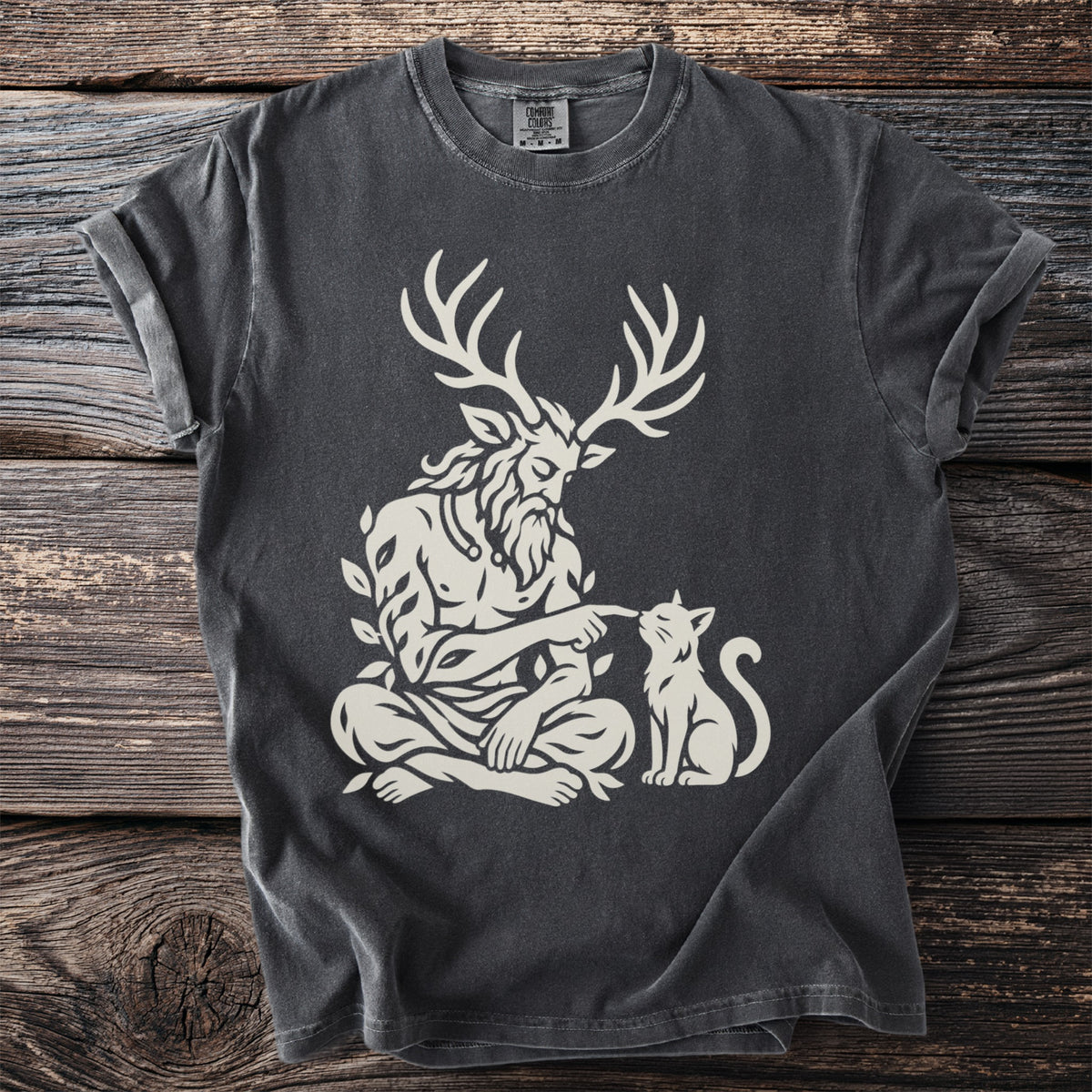 Dark grey t-shirt with a cream graphic of a horned, leafy figure interacting with a cat.
