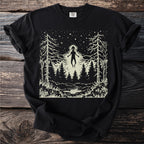 Black Comfort Colors t-shirt with an alien hovering over a forest and lake at night.
