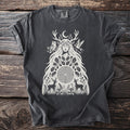Dark gray t-shirt with a cream illustration of a goddess surrounded by nature elements.