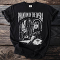 Phantom of the Opera t-shirt with a masked figure by an organ and a boat.