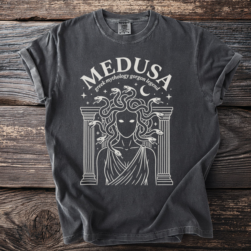 Dark grey t-shirt with a white graphic of Medusa and Greek mythology in circle.