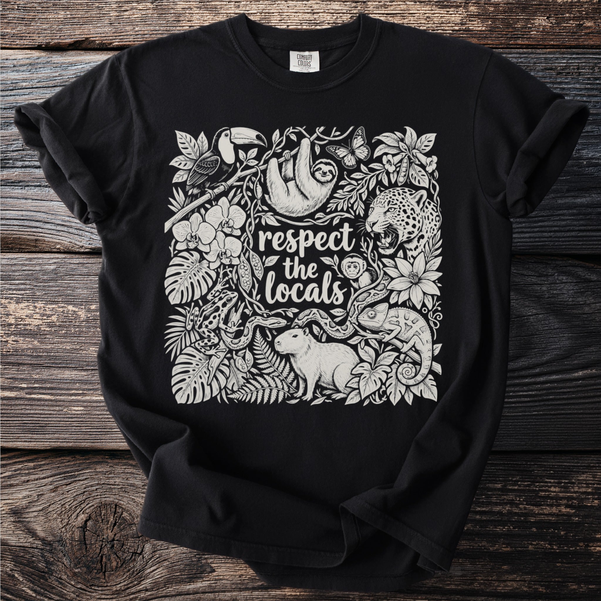 Black t-shirt with "respect the locals" text and jungle animals illustration.