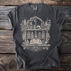 Dark t-shirt with a witchy altar graphic featuring jars, candles, and an open book.