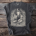 Dark gray t-shirt with a seated goat deity artwork surrounded by roses and celestial elements.