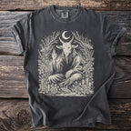 Dark gray t-shirt with a seated goat deity artwork surrounded by roses and celestial elements.