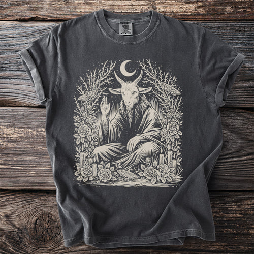 Dark gray t-shirt with a seated goat deity artwork surrounded by roses and celestial elements.