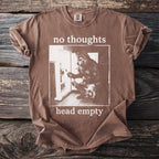 Brown t-shirt with "no thoughts head empty" text and wolf at refrigerator graphic.