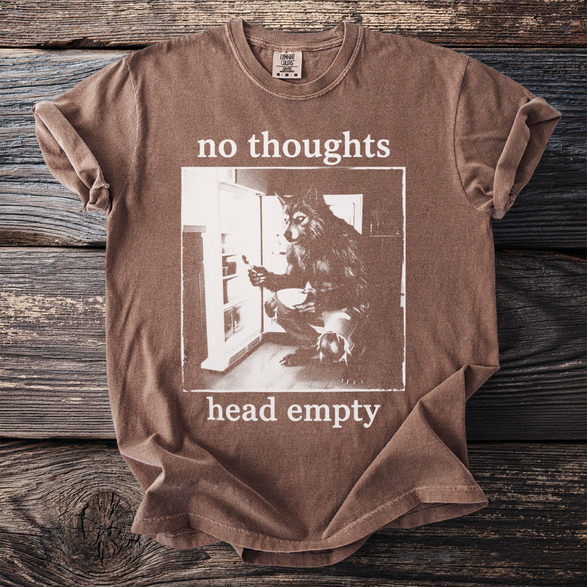 Brown t-shirt with "no thoughts head empty" text and wolf at refrigerator graphic.