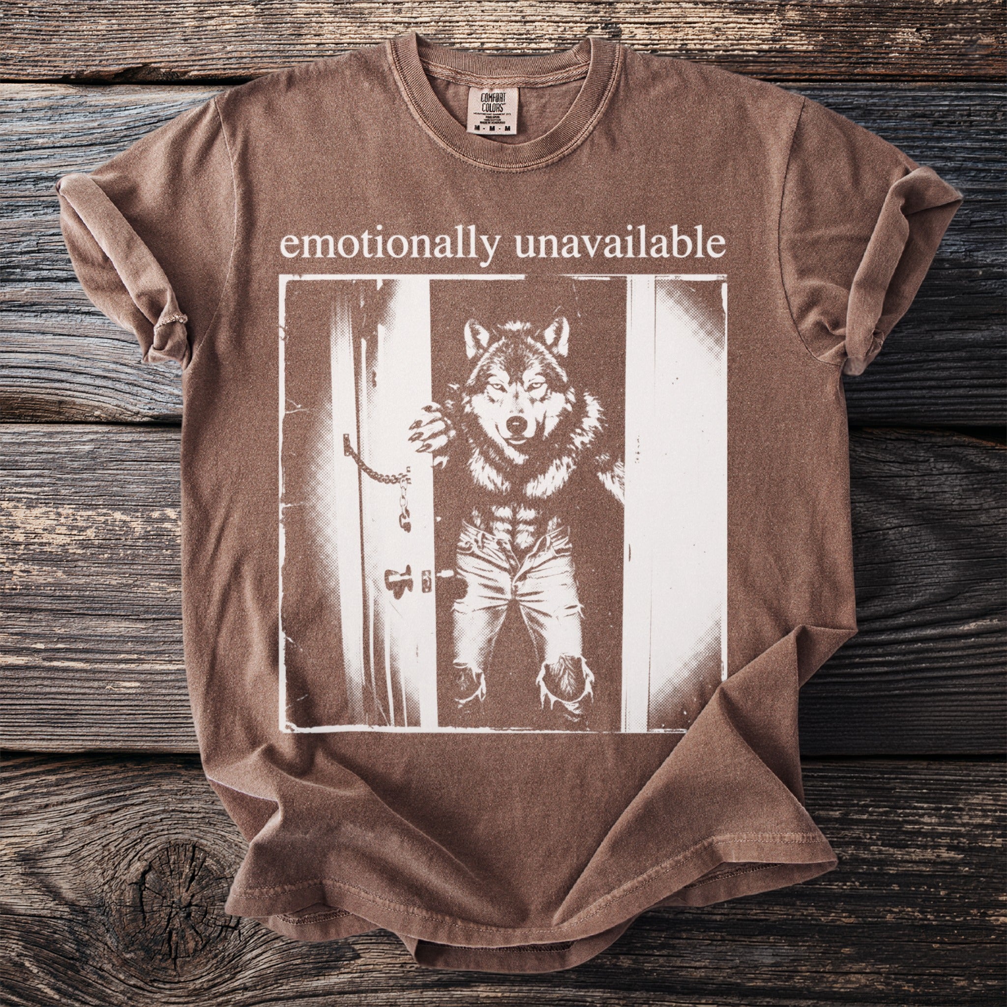 Brown t-shirt with "emotionally unavailable" text and werewolf graphic.