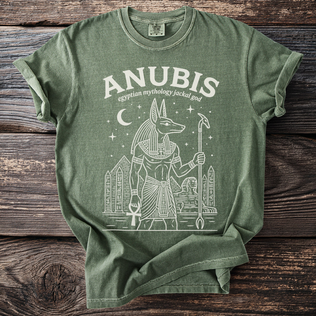 Anubis Egyptian mythology jackal god graphic on a green t-shirt.