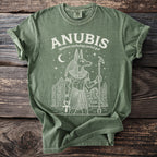 Anubis Egyptian mythology jackal god graphic on a green t-shirt.