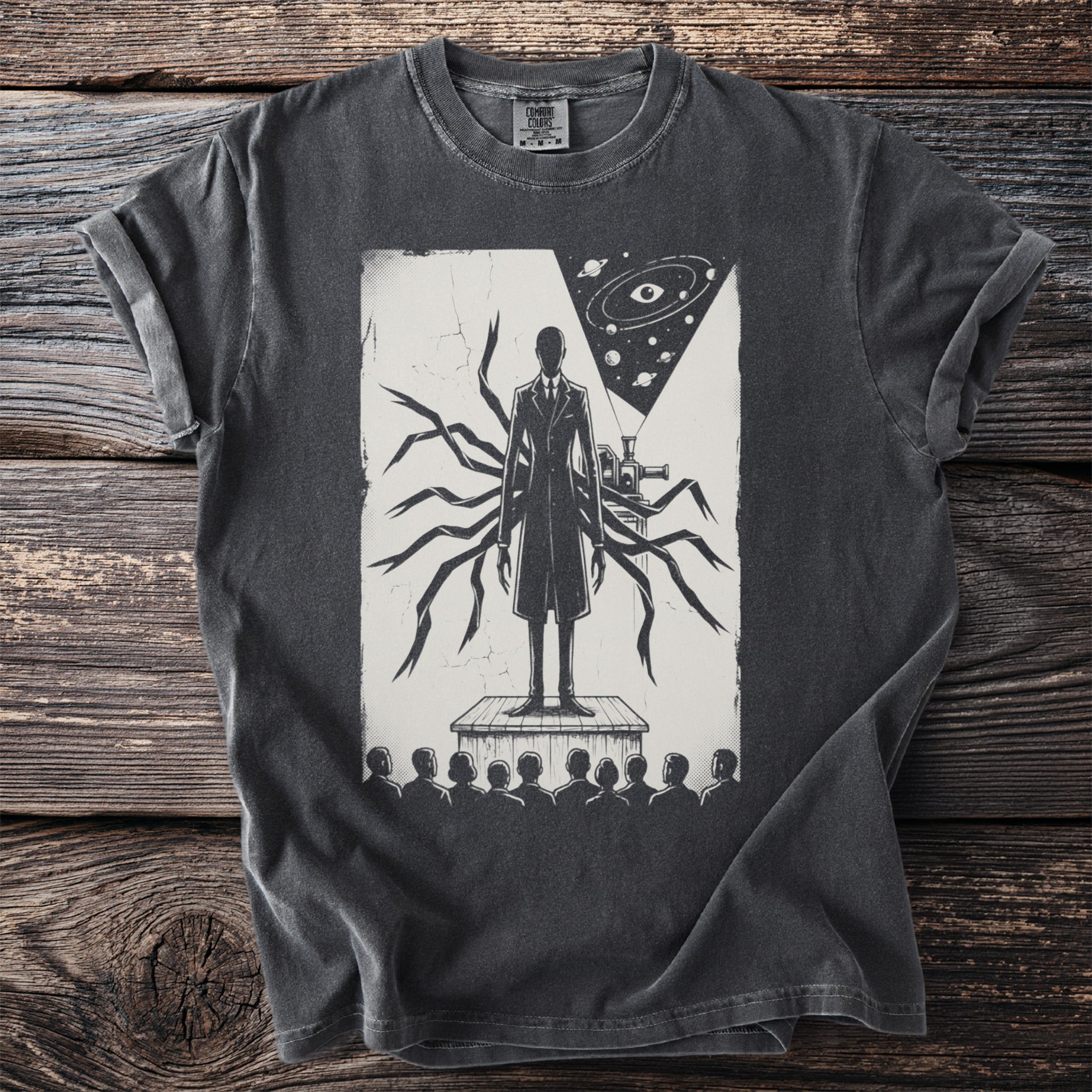 T-shirt graphic of a figure with tentacles and an eye in space.