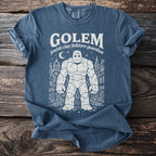 Blue t-shirt with a white line drawing of a golem and city buildings.