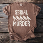 Brown t-shirt with white text "SERIAL MURDER" and four crows.