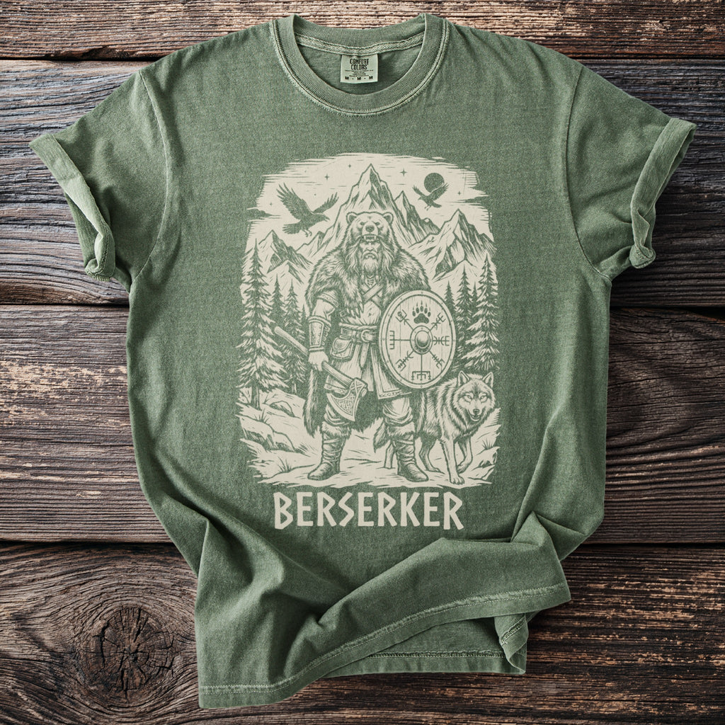 Green t-shirt with a graphic of a Viking warrior, a wolf, bear, and mountains.
